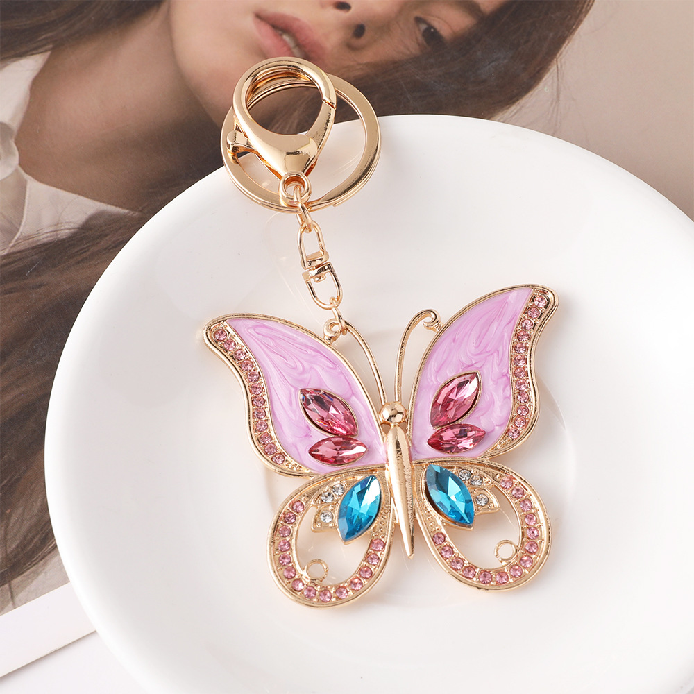 Modne różowe breloczki z motyl – Luxury Bags Wholesale recenzja i cena